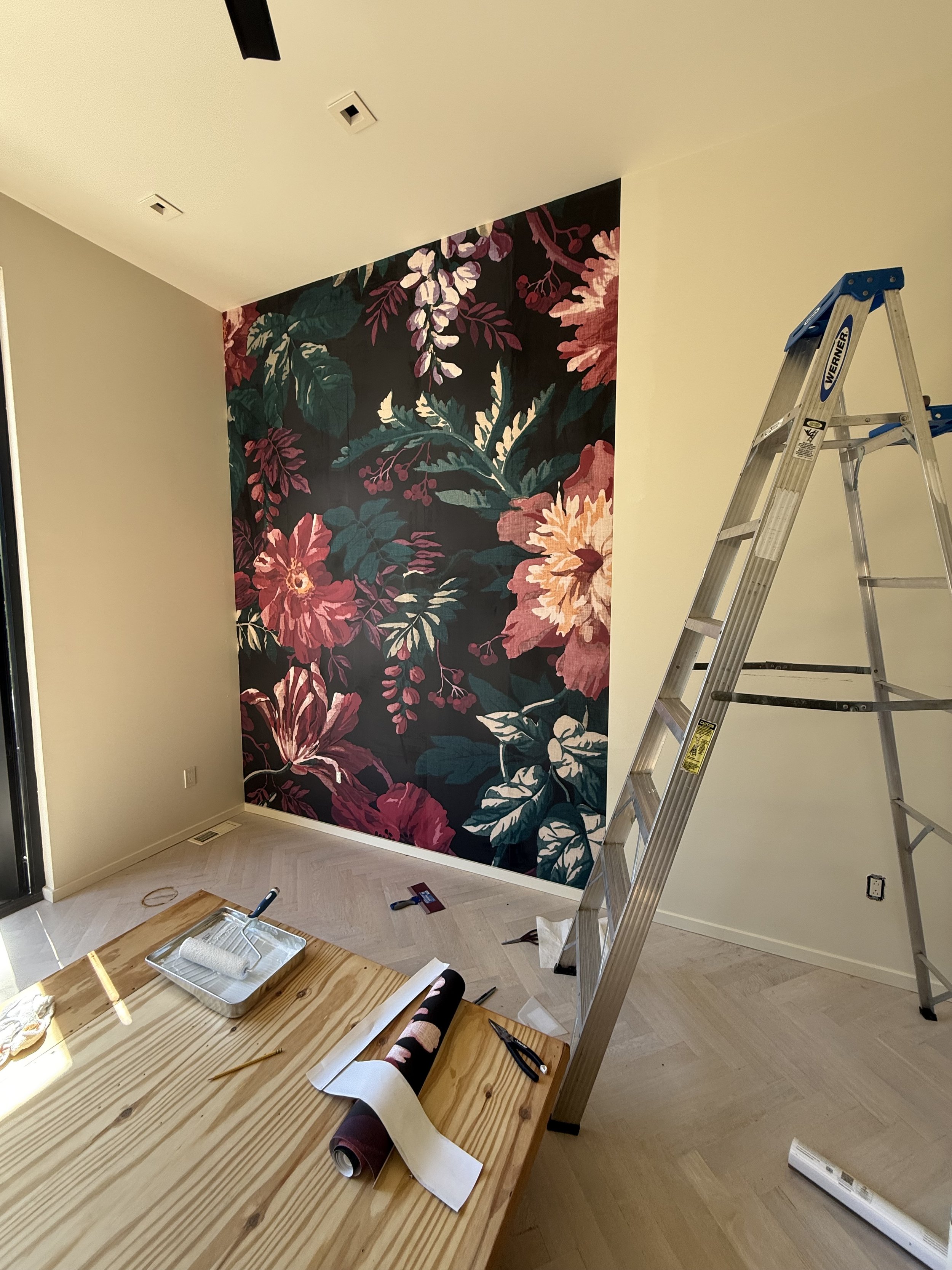 Expert wallpaper installation in progress